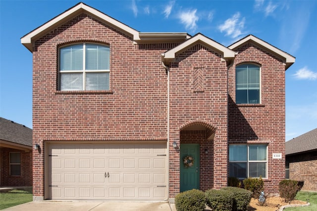 traditional home with brick siding, driveway, and an attached garage