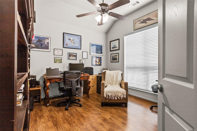 office with lofted ceiling, wood finished floors, visible vents, and a ceiling fan