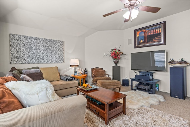 living area with a ceiling fan, lofted ceiling, carpet flooring, and baseboards