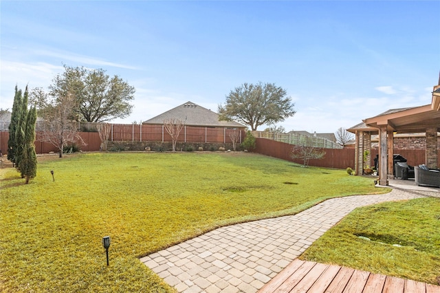 view of yard with a patio and a fenced backyard