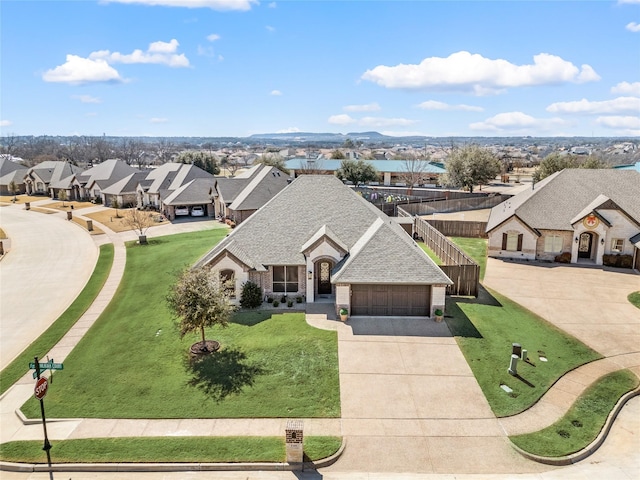 birds eye view of property with a residential view