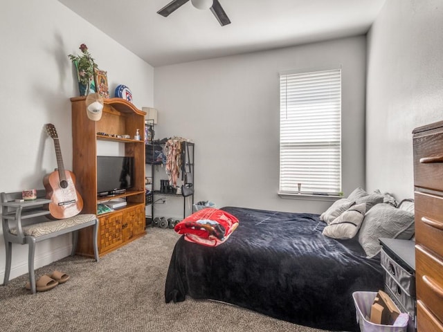 bedroom with carpet floors and a ceiling fan