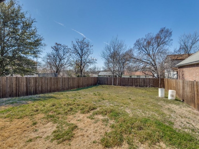 view of yard with a fenced backyard