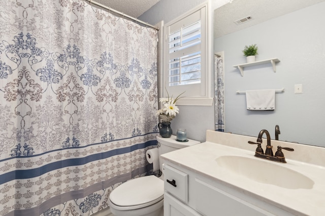 full bathroom with visible vents, a textured ceiling, toilet, and vanity