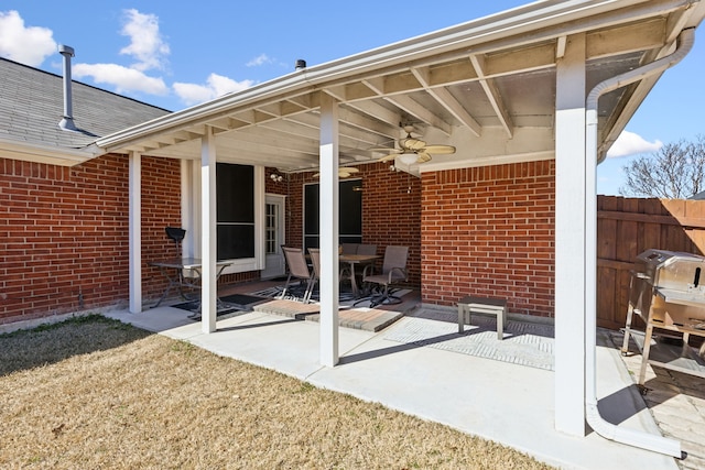 view of patio / terrace featuring fence