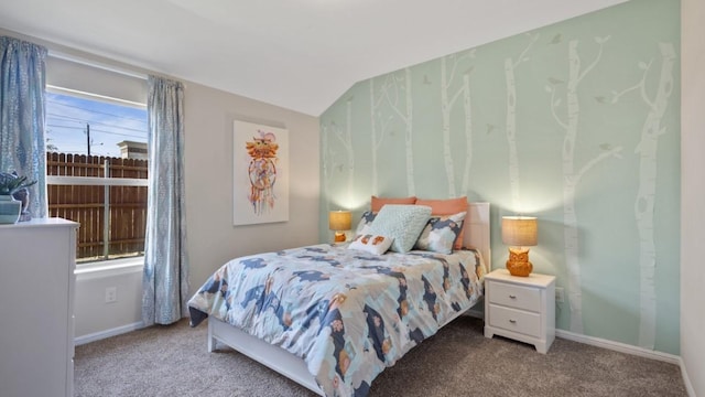 bedroom with vaulted ceiling, carpet floors, and baseboards