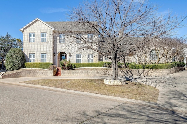 view of front facade featuring brick siding