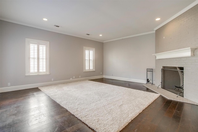 living area with a brick fireplace, baseboards, ornamental molding, and dark wood-type flooring