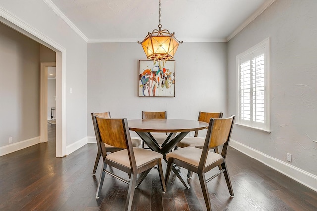 dining space featuring baseboards, dark wood-type flooring, and crown molding