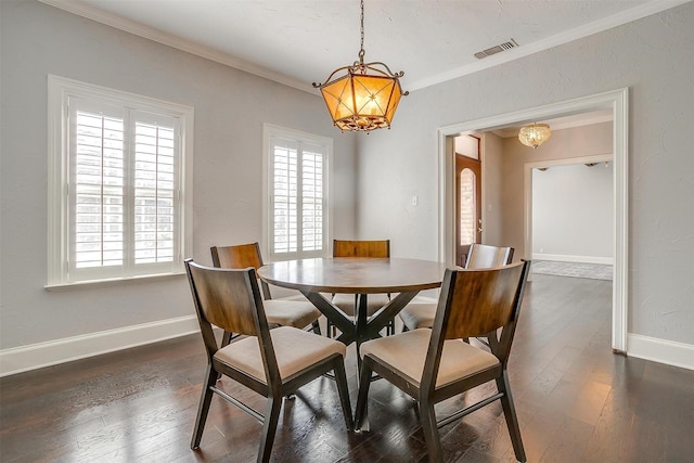 dining space with baseboards, dark wood-style flooring, a wealth of natural light, and crown molding