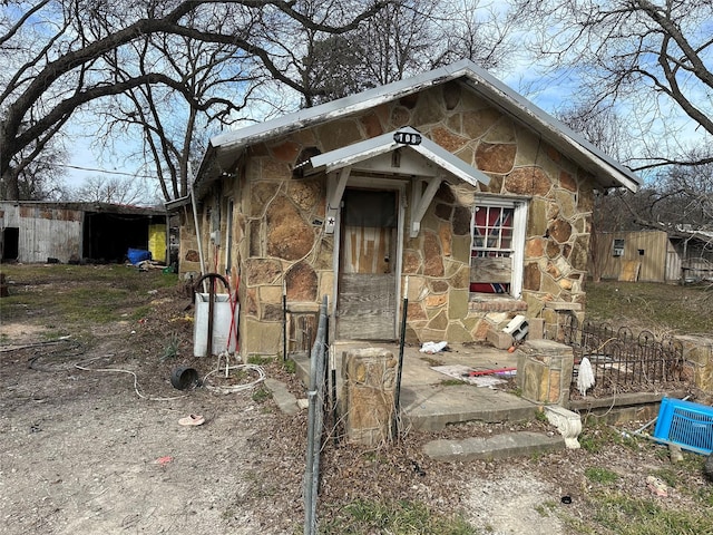 view of front of home with stone siding