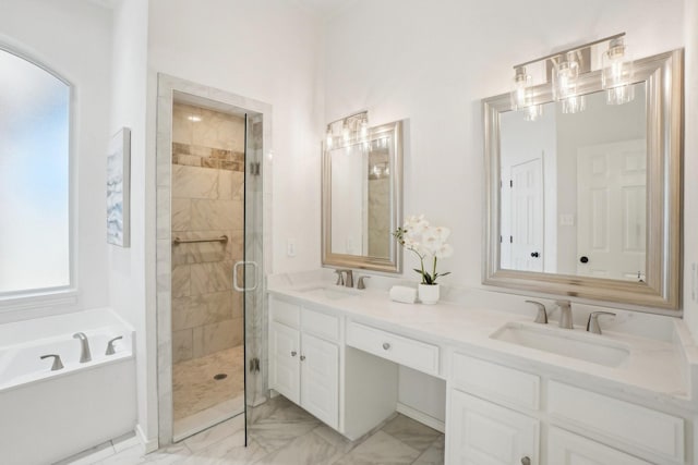 full bathroom featuring marble finish floor, a sink, a shower stall, and a bath