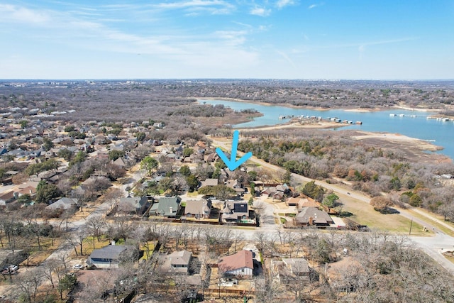 drone / aerial view featuring a water view and a residential view