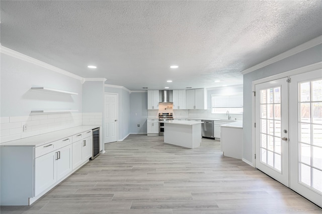 kitchen with wine cooler, french doors, appliances with stainless steel finishes, backsplash, and open shelves