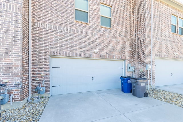 exterior space featuring concrete driveway