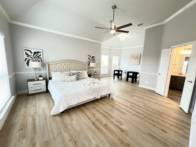 bedroom with high vaulted ceiling, visible vents, crown molding, and light wood-style flooring