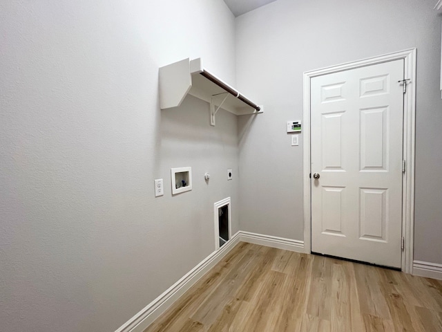 laundry area featuring light wood-style flooring, hookup for a gas dryer, laundry area, washer hookup, and electric dryer hookup