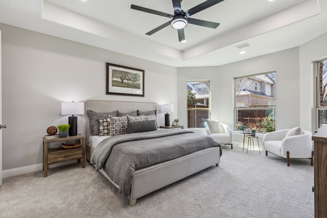 bedroom featuring visible vents, baseboards, a raised ceiling, carpet, and recessed lighting