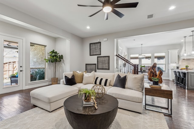 living area featuring wood finished floors, ceiling fan, visible vents, and recessed lighting