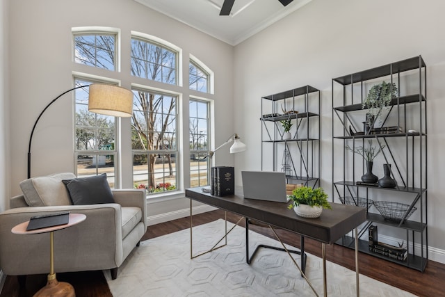 home office with crown molding, ceiling fan, wood finished floors, and baseboards