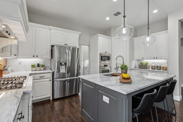 kitchen with white cabinetry, visible vents, appliances with stainless steel finishes, and dark wood-style floors