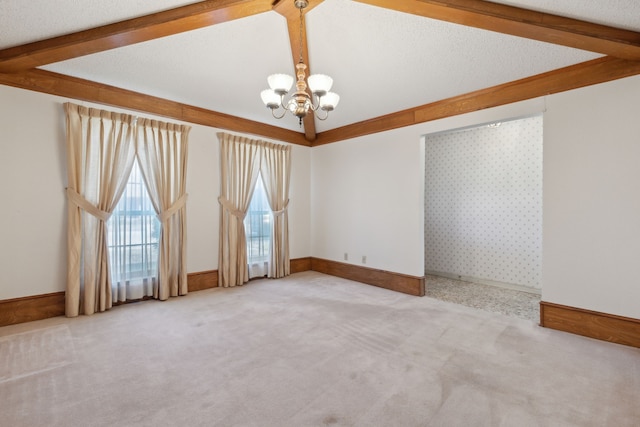 unfurnished room featuring carpet floors, lofted ceiling with beams, an inviting chandelier, a textured ceiling, and baseboards