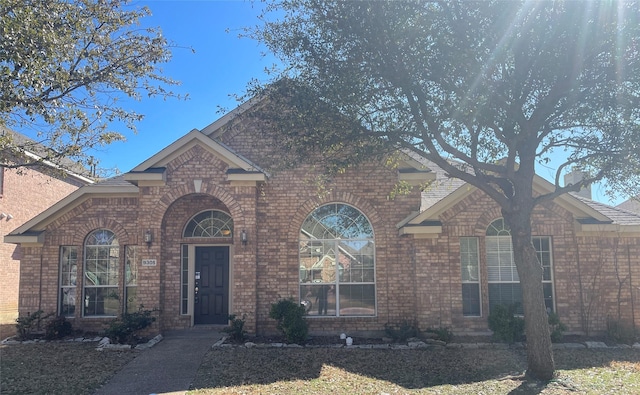 view of front of home with brick siding