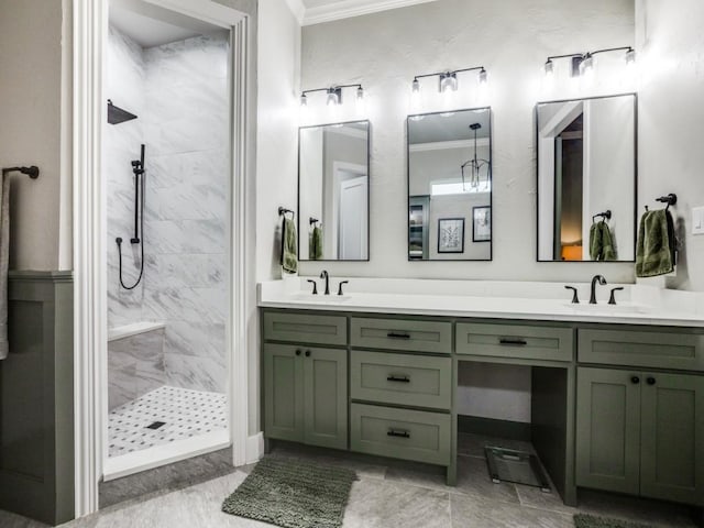 bathroom with double vanity, walk in shower, a sink, and crown molding