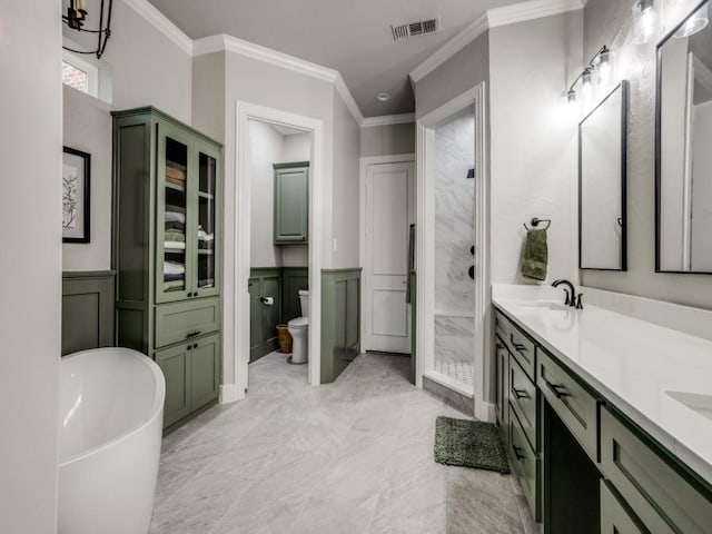 bathroom featuring visible vents, wainscoting, toilet, ornamental molding, and a sink