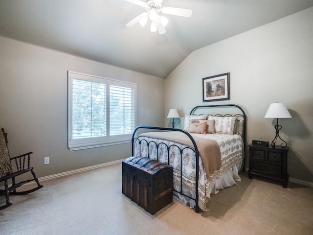 carpeted bedroom with lofted ceiling, ceiling fan, and baseboards