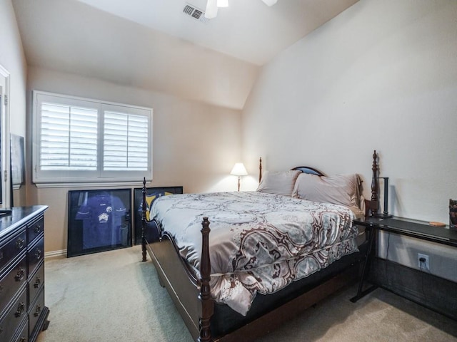 bedroom featuring light colored carpet, visible vents, ceiling fan, and lofted ceiling