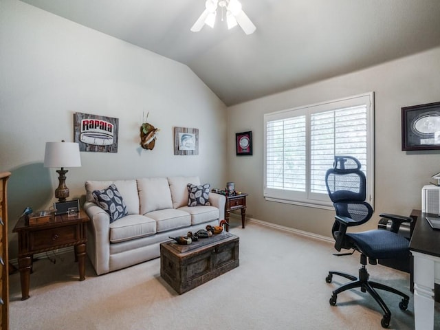 office space featuring lofted ceiling, carpet flooring, ceiling fan, and baseboards