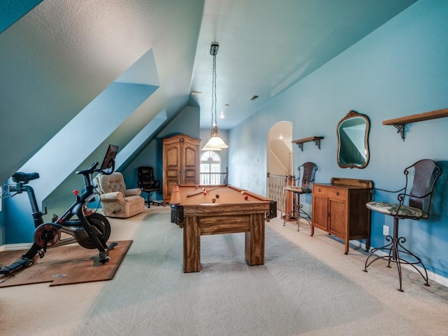 rec room featuring carpet floors, arched walkways, vaulted ceiling, and pool table