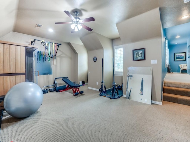 exercise area featuring ceiling fan, visible vents, baseboards, and carpet flooring