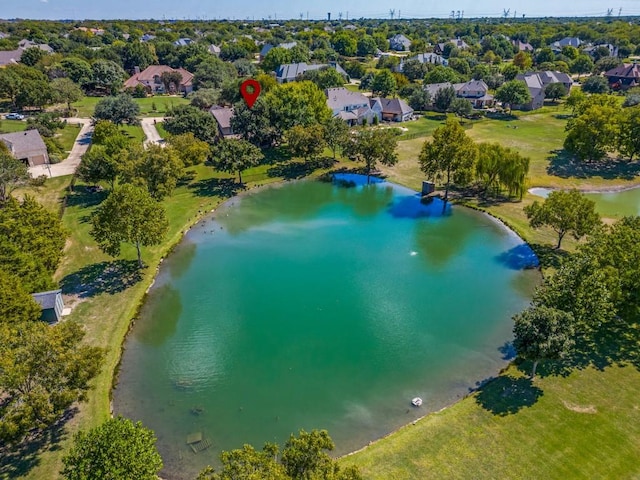 drone / aerial view featuring a water view and a residential view