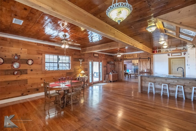 unfurnished dining area with wooden ceiling, ceiling fan, and wood finished floors