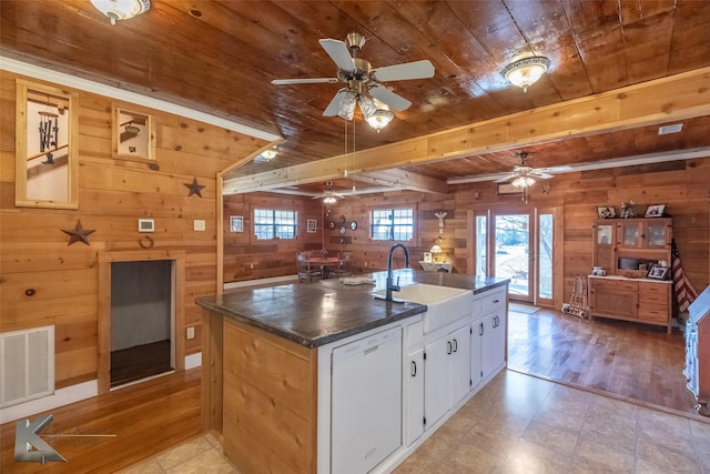 kitchen featuring wood ceiling, visible vents, white dishwasher, and a sink