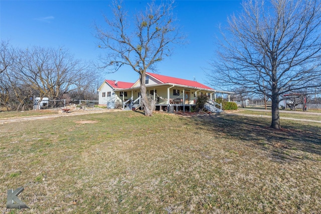 farmhouse featuring a porch and a front lawn