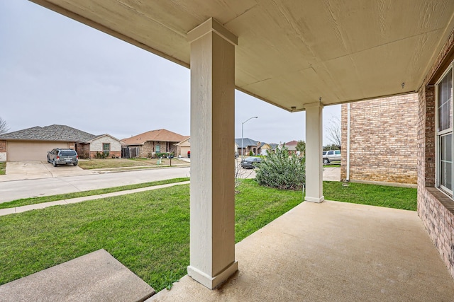 view of patio featuring covered porch and a residential view