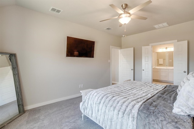 bedroom featuring carpet floors, visible vents, and lofted ceiling