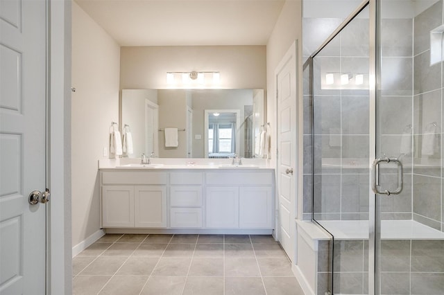 full bath featuring a stall shower, a sink, and double vanity