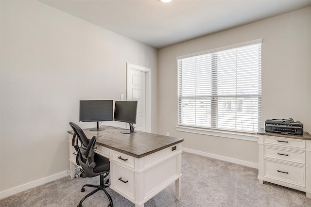 office featuring light carpet and baseboards