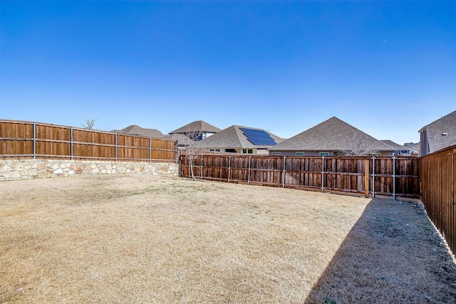 view of yard featuring a fenced backyard