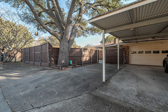 exterior space with a garage and fence