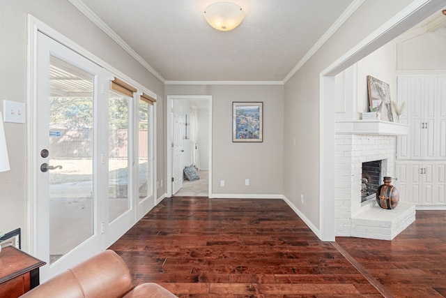 interior space featuring a brick fireplace, ornamental molding, and wood finished floors