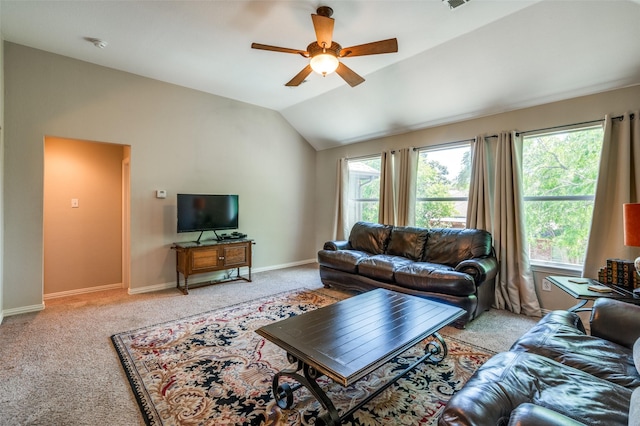 living room with vaulted ceiling, light carpet, and a wealth of natural light