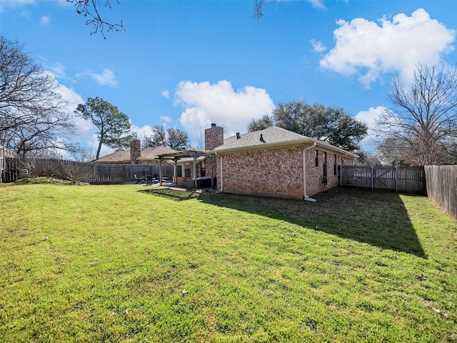 view of yard featuring a fenced backyard