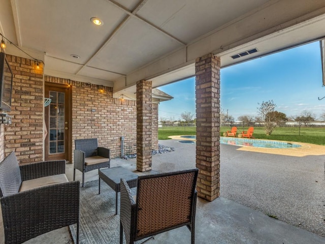 view of patio / terrace featuring an outdoor pool