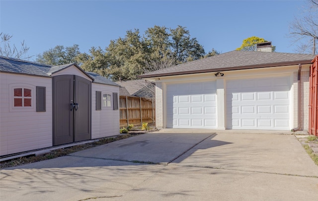 921 Sandalwood Ave, Richardson, TX 75080 - garage featuring driveway and a storage shed