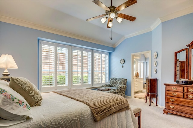 carpeted bedroom featuring ceiling fan, baseboards, crown molding, and ensuite bathroom